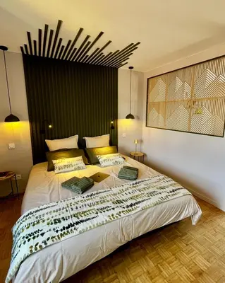 Un ou plusieurs lits dans un hébergement de l'établissement Wisteria Villa- Souffle de Songe
