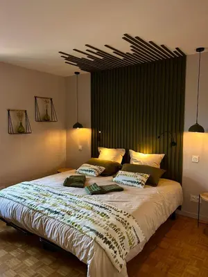 Un ou plusieurs lits dans un hébergement de l'établissement Wisteria Villa- Souffle de Songe