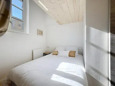Un ou plusieurs lits dans un hébergement de l'établissement Les Vignes 3 Chambres avec Salle de bain privative