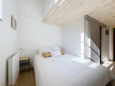 Un ou plusieurs lits dans un hébergement de l'établissement Les Vignes 3 Chambres avec Salle de bain privative