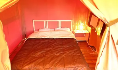 Un ou plusieurs lits dans un hébergement de l'établissement Camping Point Vert
