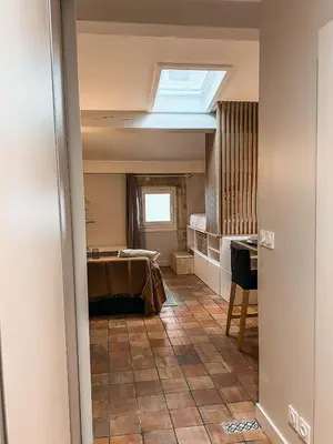 Un ou plusieurs lits dans un hébergement de l'établissement Studio cosy Villefranche-Sur-Saône