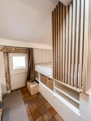 Un ou plusieurs lits dans un hébergement de l'établissement Studio cosy Villefranche-Sur-Saône
