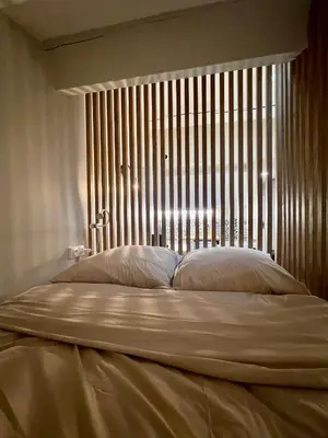 Un ou plusieurs lits dans un hébergement de l'établissement Studio cosy Villefranche-Sur-Saône