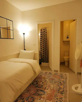 Un ou plusieurs lits dans un hébergement de l'établissement Cosy studio 14m2 centre-ville