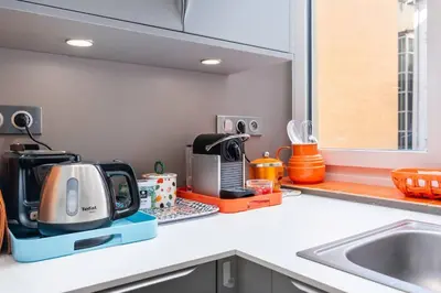 Cuisine ou kitchenette dans l'établissement Appartement cosy plein centre - l'Annexe