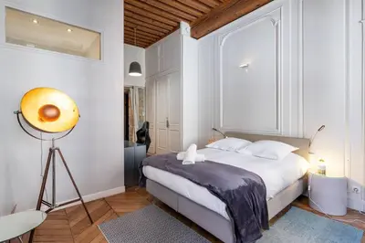 Un ou plusieurs lits dans un hébergement de l'établissement Appartement cosy plein centre - l'Annexe