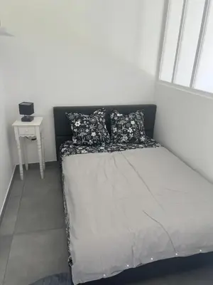 Un ou plusieurs lits dans un hébergement de l'établissement Petite maison au calme