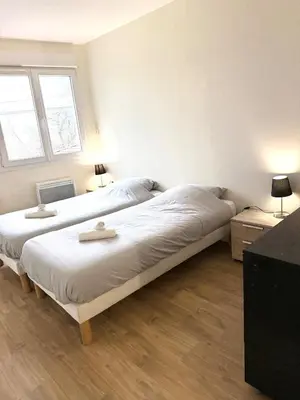 Un ou plusieurs lits dans un hébergement de l'établissement T3 Rez de Jardin Leyment
