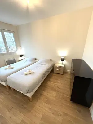 Un ou plusieurs lits dans un hébergement de l'établissement T3 Rez de Jardin Leyment