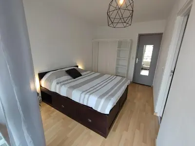 Un ou plusieurs lits dans un hébergement de l'établissement Grand T2 central, balcons sur parc