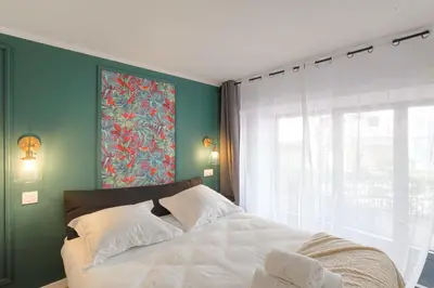 Un ou plusieurs lits dans un hébergement de l'établissement Cosy et Design duplex Brotteaux - Masséna