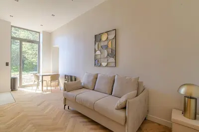 Coin salon dans l'établissement Studio avec terrasse aux portes de Lyon, Ecully