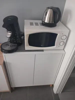 Cuisine ou kitchenette dans l'établissement Chambre salle de bain clim