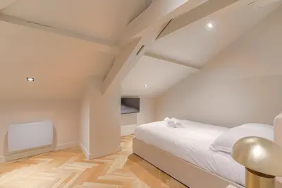 Un ou plusieurs lits dans un hébergement de l'établissement Superbe appartement lumineux proche de Lyon
