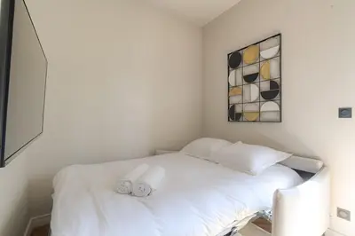 Un ou plusieurs lits dans un hébergement de l'établissement Superbe appartement lumineux proche de Lyon