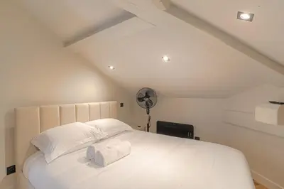 Un ou plusieurs lits dans un hébergement de l'établissement Appartement contemporain au calme, Ecully