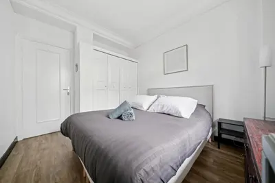 Un ou plusieurs lits dans un hébergement de l'établissement Magnifique appartement au cœur du 6ème