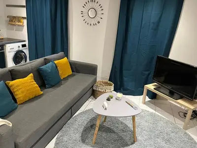 Télévision ou salle de divertissement dans l'établissement Joli duplex en plein cœur du centre ville
