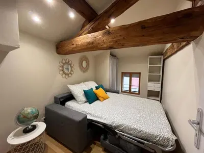 Un ou plusieurs lits dans un hébergement de l'établissement Joli duplex en plein cœur du centre ville
