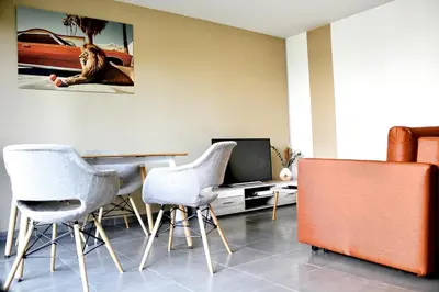 Coin salon dans l'établissement Appartement proche grands axes - parking privé