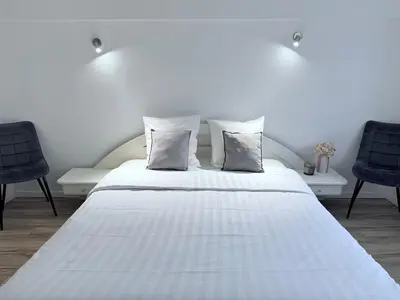Un ou plusieurs lits dans un hébergement de l'établissement Villa Lumière - Confort, spa, piscine, recharge véhicule & babyfoot