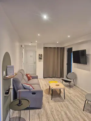 Télévision ou salle de divertissement dans l'établissement Maison La Praline