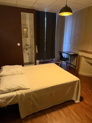 Un ou plusieurs lits dans un hébergement de l'établissement Hôtel d'Enghien