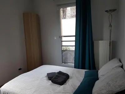 Un ou plusieurs lits dans un hébergement de l'établissement Duplex cosy - 3 chambres avec garage, balcon et clim