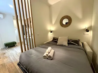Un ou plusieurs lits dans un hébergement de l'établissement L'Écrin de Duguesclin Comfort & Charm in Lyon 3rd arrondissement
