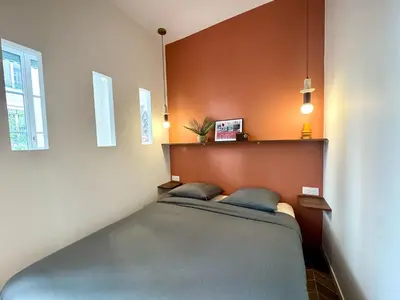 Un ou plusieurs lits dans un hébergement de l'établissement Lumiere - Chic cocoon au coeur de lyon