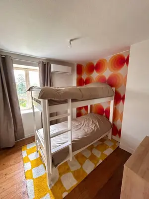 Un ou plusieurs lits dans un hébergement de l'établissement Maison Auros