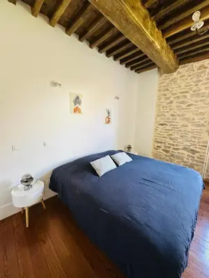 Un ou plusieurs lits dans un hébergement de l'établissement Superbe maison en pierre