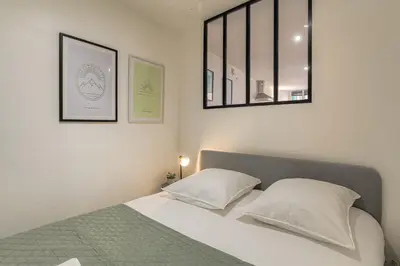 Un ou plusieurs lits dans un hébergement de l'établissement Le Siméon - T2 plein pied, cosy, au cœur de la zone piétonne