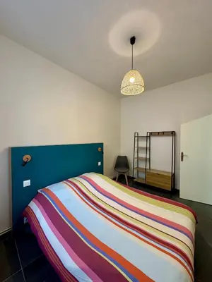 Un ou plusieurs lits dans un hébergement de l'établissement Appartement à Vienne