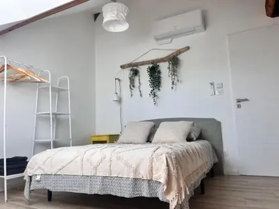 Un ou plusieurs lits dans un hébergement de l'établissement Appartement Ampuis Villa Monplaisir