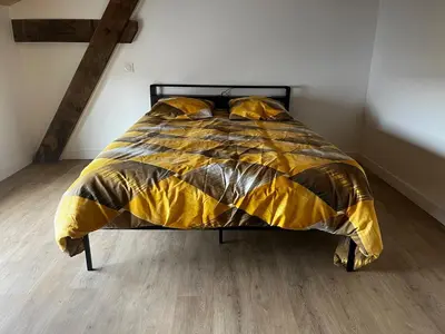 Un ou plusieurs lits dans un hébergement de l'établissement Villa en campagne