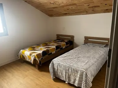 Un ou plusieurs lits dans un hébergement de l'établissement Villa en campagne