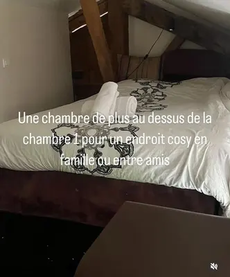 Un ou plusieurs lits dans un hébergement de l'établissement La Rose du Petit Bois