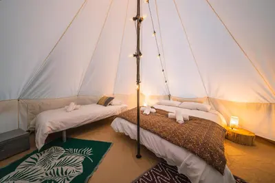 Un ou plusieurs lits dans un hébergement de l'établissement Campement au reve - Genouilleux