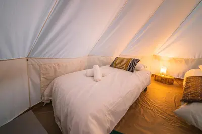 Un ou plusieurs lits dans un hébergement de l'établissement Campement au reve - Genouilleux