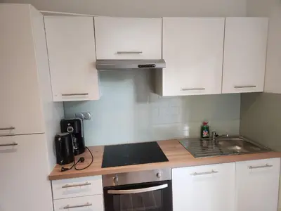 Cuisine ou kitchenette dans l'établissement Studio calme