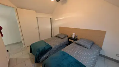 Un ou plusieurs lits dans un hébergement de l'établissement Duplex avec Parking