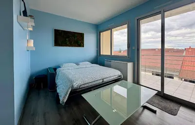 Un ou plusieurs lits dans un hébergement de l'établissement L'azur cosy studio Meyzieu