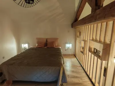 Un ou plusieurs lits dans un hébergement de l'établissement appartement cosy