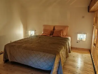 Un ou plusieurs lits dans un hébergement de l'établissement appartement cosy
