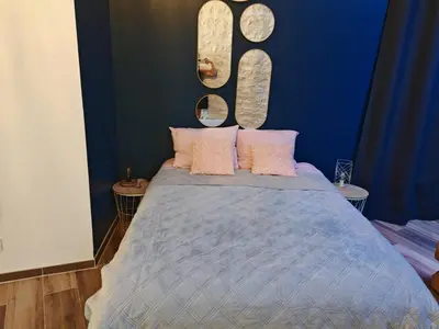 Un ou plusieurs lits dans un hébergement de l'établissement appartement cosy