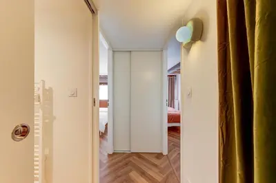 Un ou plusieurs lits dans un hébergement de l'établissement Le Velours 2 bedrooms 4 beds central