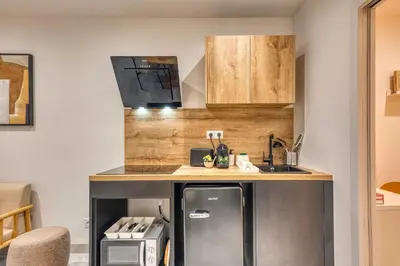 Cuisine ou kitchenette dans l'établissement Le Bois Doré - Cosy - Sainte-Foy-Les-Lyon