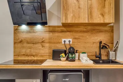 Cuisine ou kitchenette dans l'établissement Le Bois Doré - Cosy - Sainte-Foy-Les-Lyon
